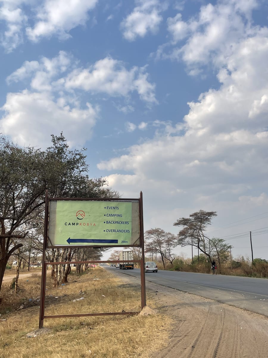The Camp Kobya sign along the main road