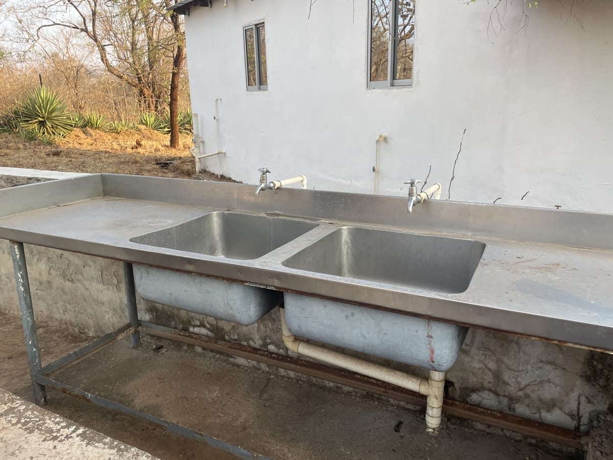 An outdoor wash station at Camp Kobya